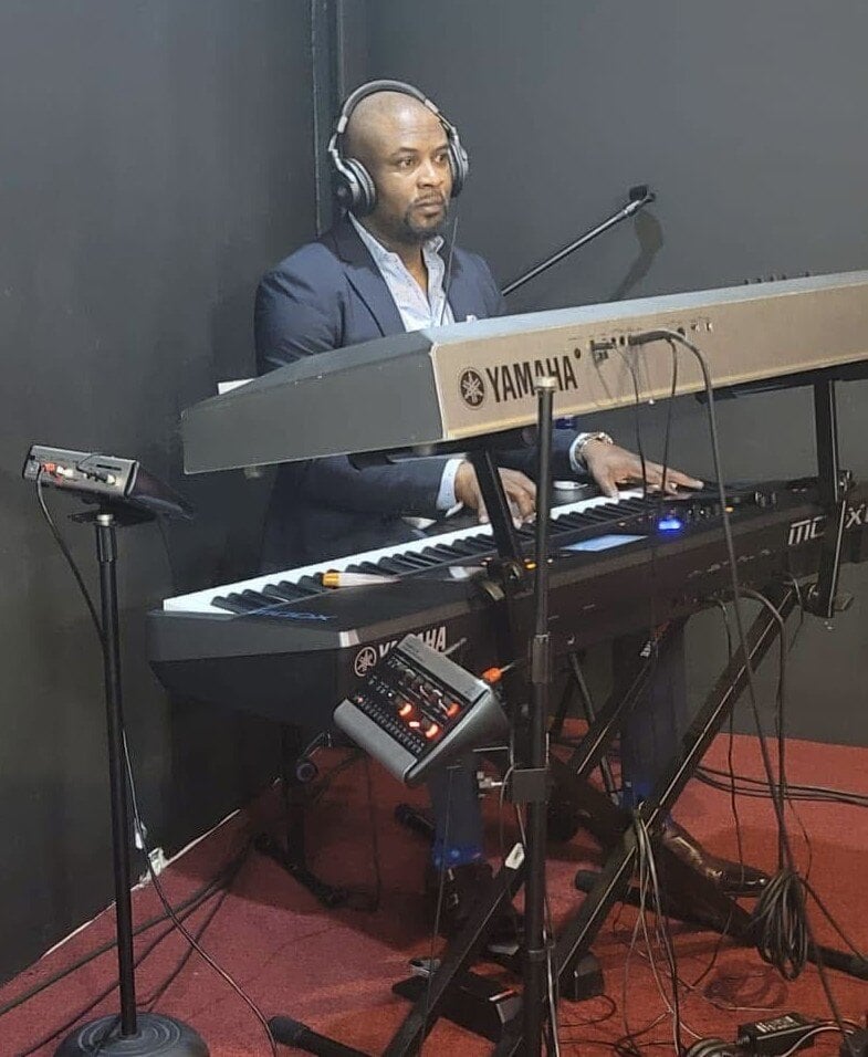 Tosin at church where he is the Music Director playing keyboard